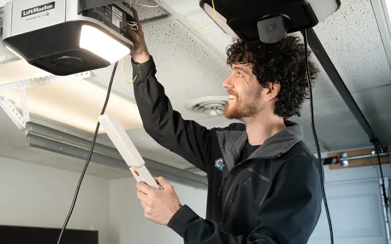 Century technician installing a LiftMaster opener