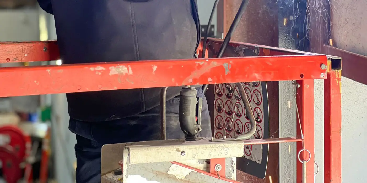 Century technician working on garage door cables and drums
