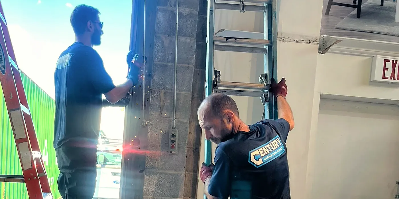 Century technicians installing a new garage door in New York