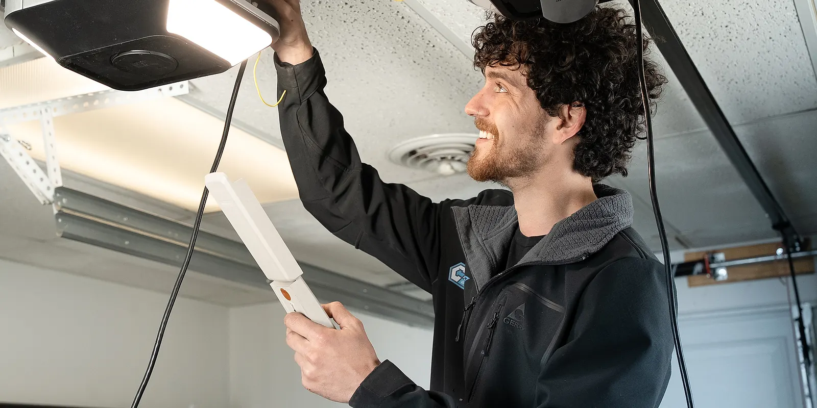 Century technicians installing a new garage door opener
